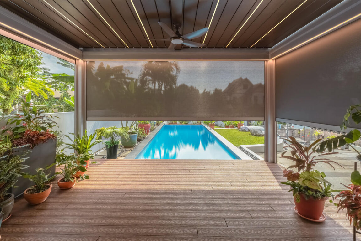 Enhance your poolside oasis with a motorized pergola, adding elegance and functionality to your outdoor space